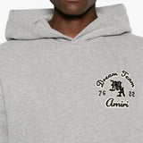 Grey t-shirt worn by a person, showing the t-shirt fit