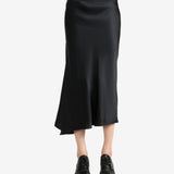 Black skirt worn by a person, showing the skirt's fit
