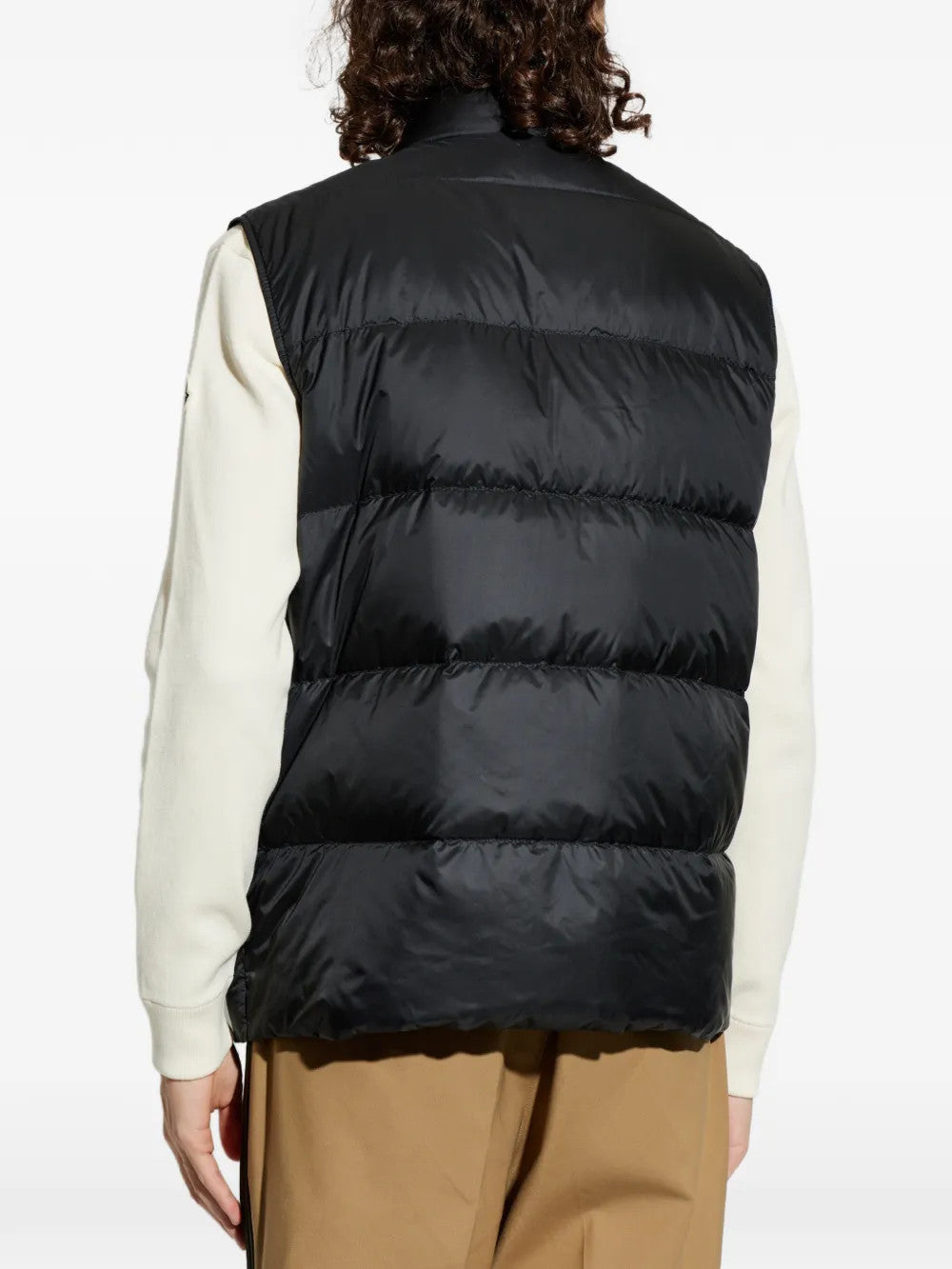 Black jacket worn by a person, showing the jacket fit