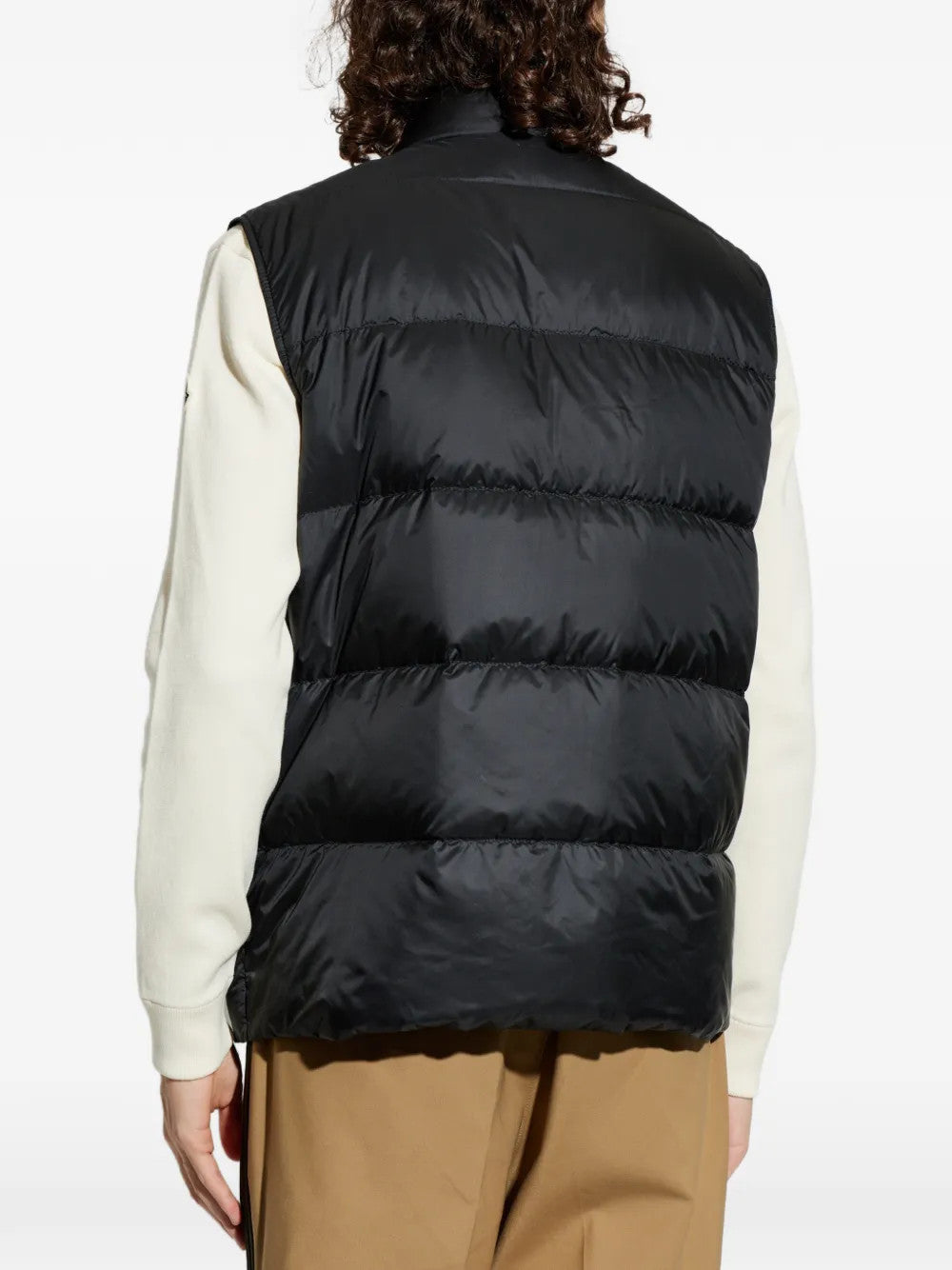 Black jacket worn by a person, showing the jacket fit