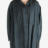 Black shirt,worn by a person, showing the shirt's fit