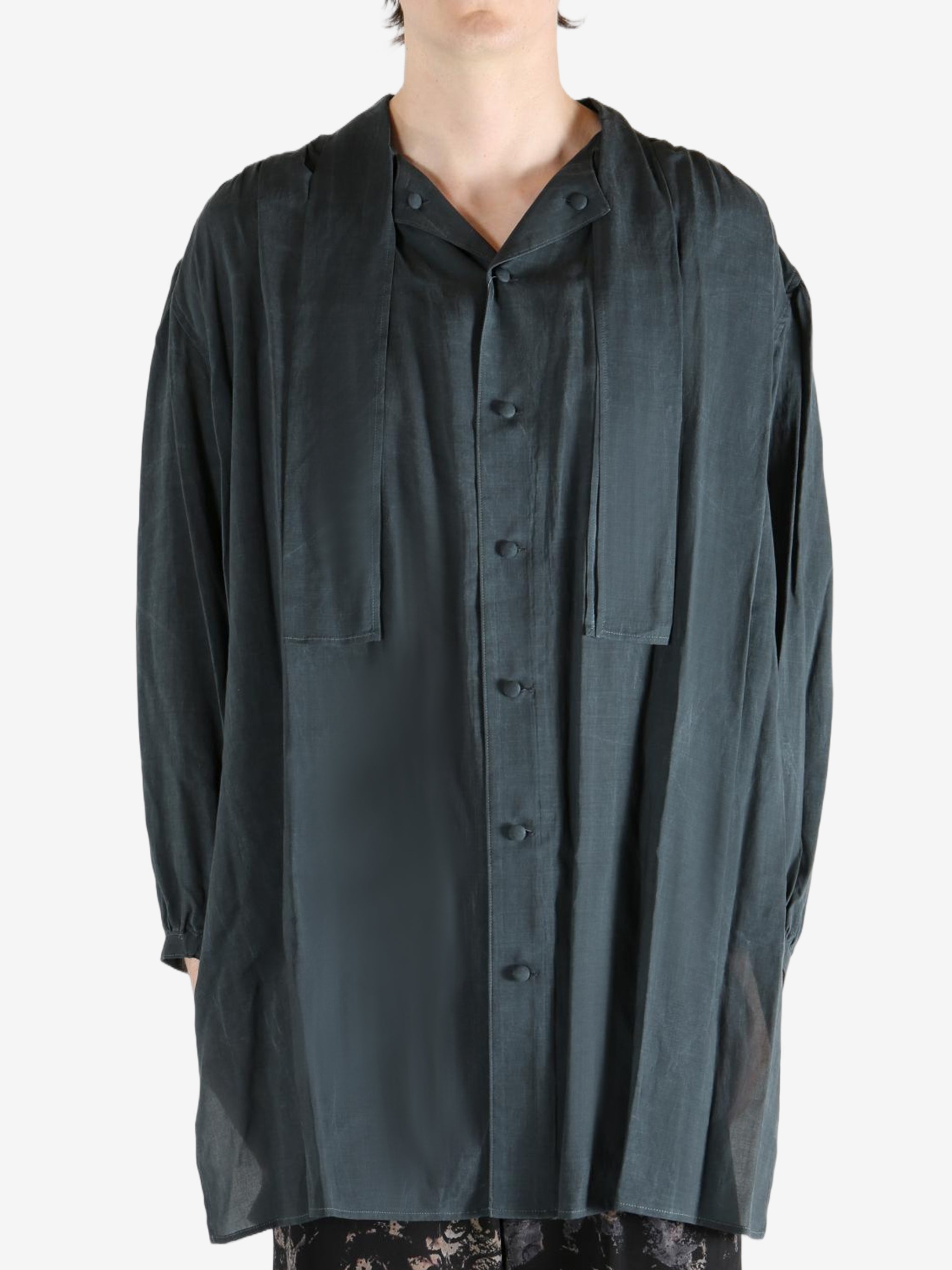 Black shirt,worn by a person, showing the shirt's fit