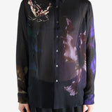 Black shirt worn by a person, showing the shirt's fit