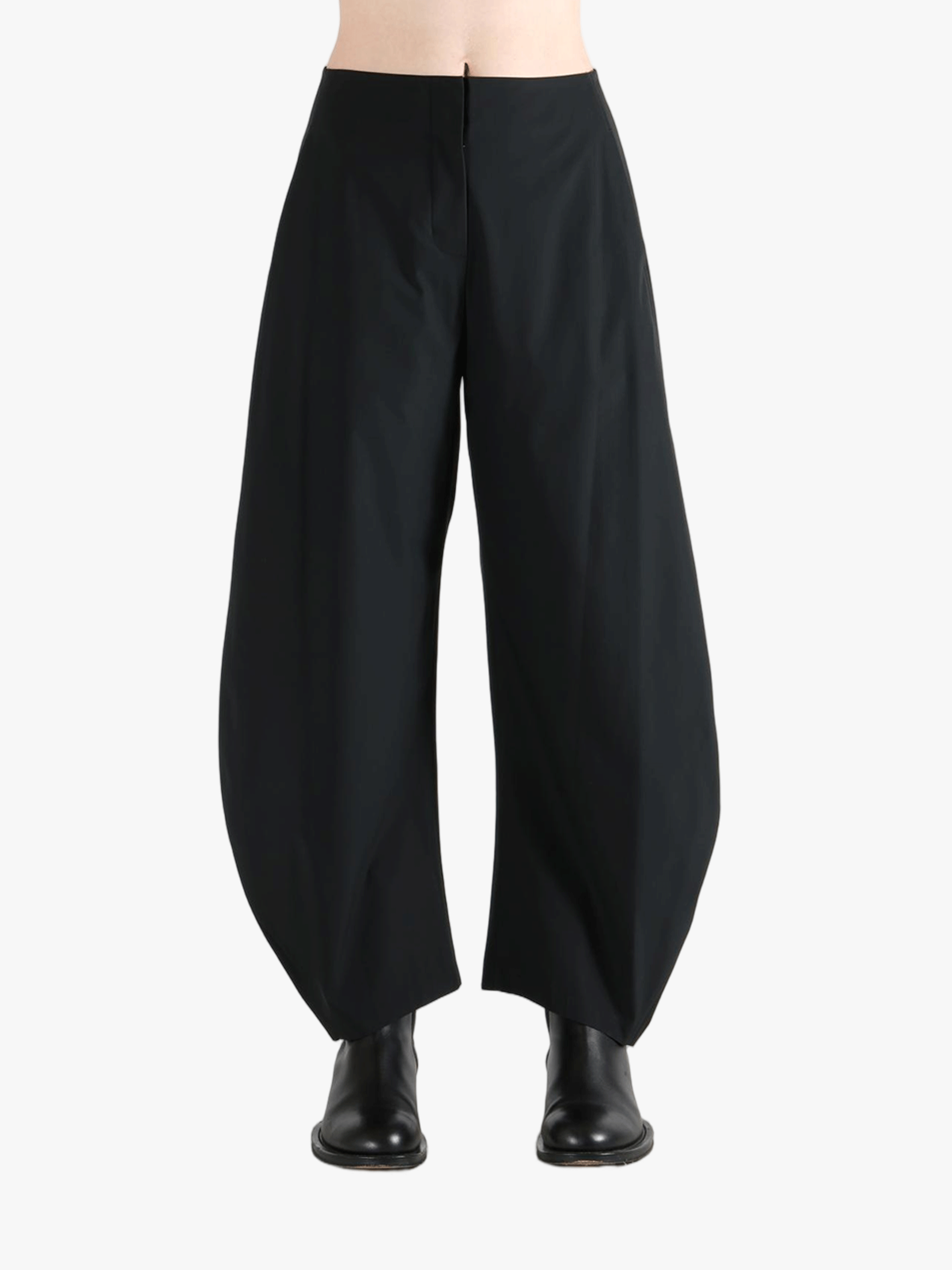 Black pants worn by a person, showing the pants' fit