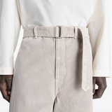 Close up of beige wide-leg pant,showing texture of the cotton fabric