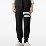 black pants worn by a person, showing the pants fit