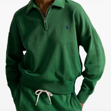 Green sweatshirt worn by a person, showing the sweatshirt‘s fit