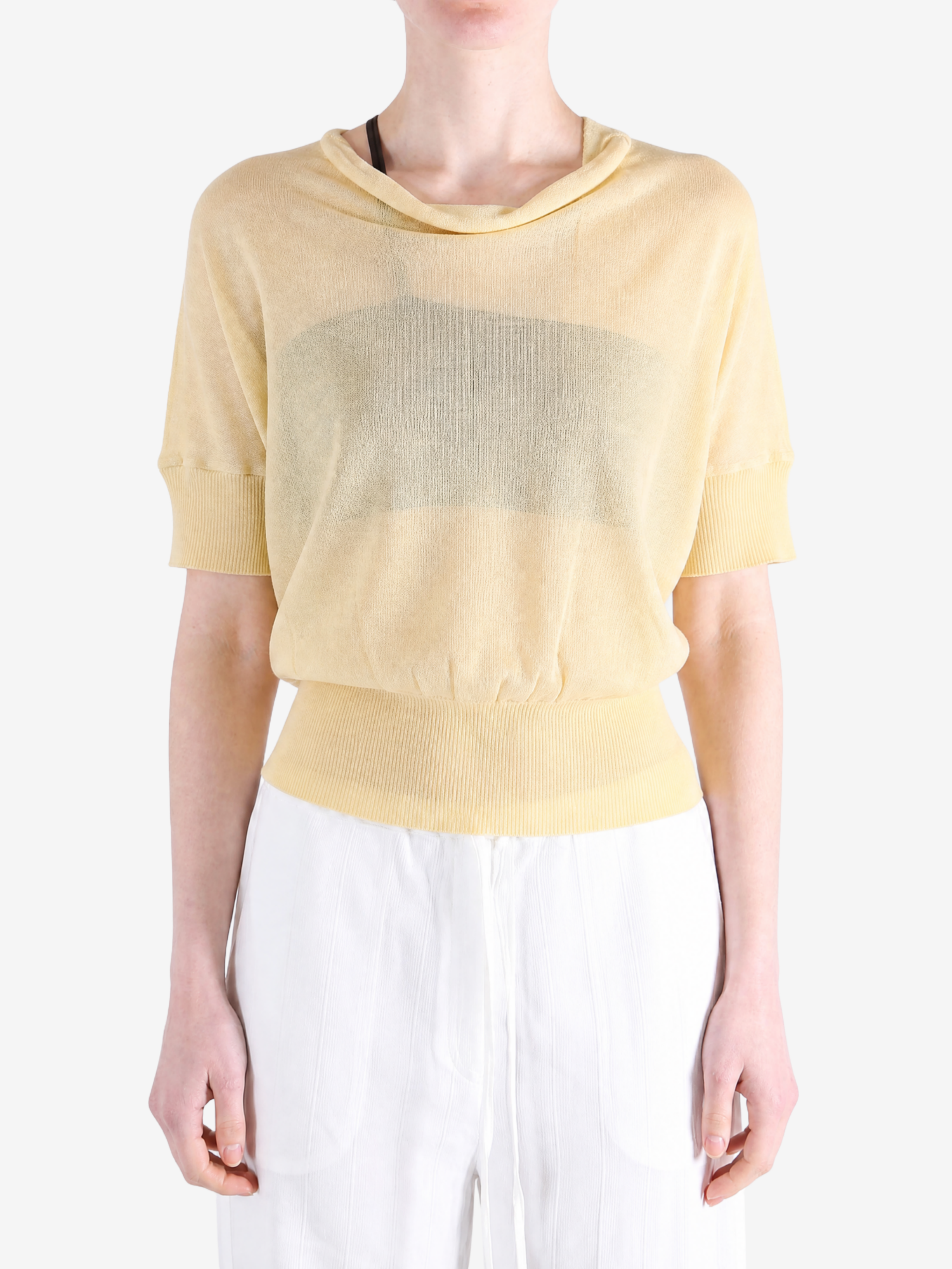 Yellow knitwear worn by a person, showing the knitwear fit