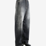 Black jeans worn by a person, showing the jeans' fit