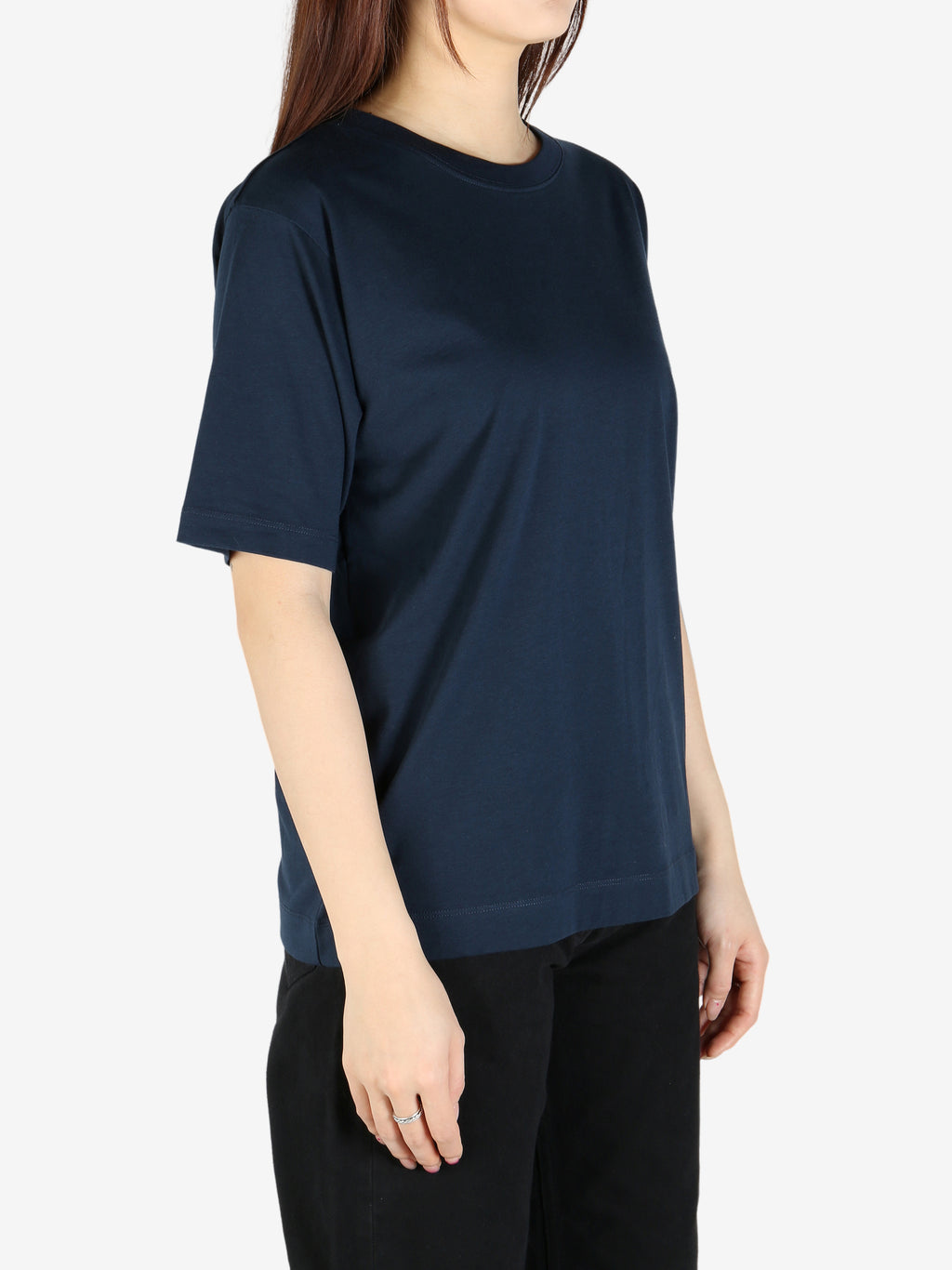 Navy tee worn by a person, showing the tee's fit