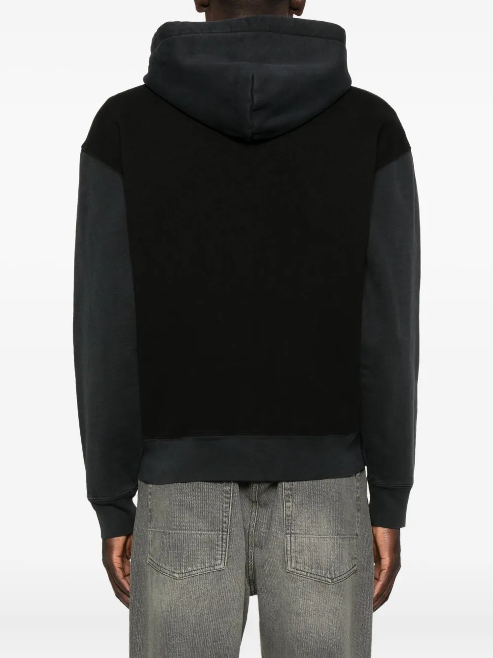 Black hoodie worn by a person, showing the hoodie fit