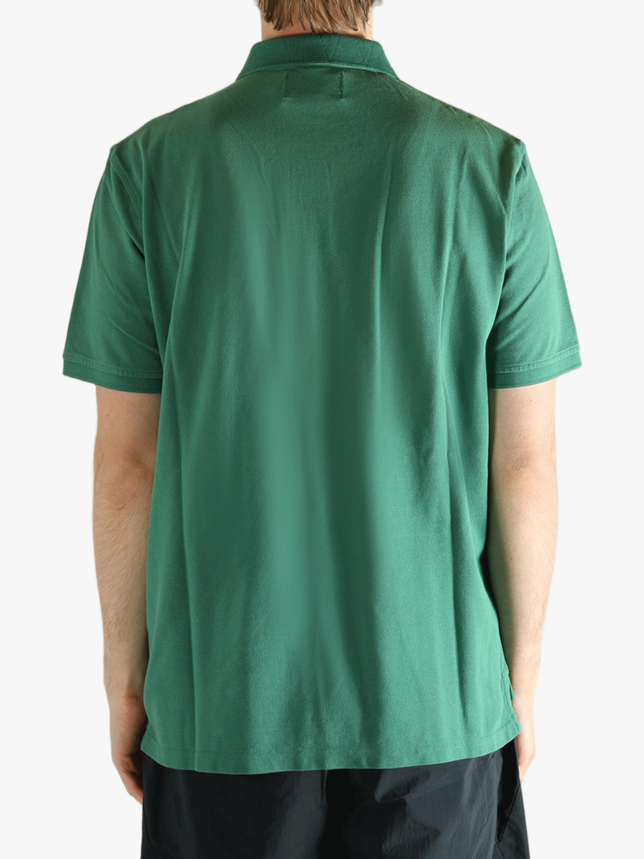 Green t-shirt  worn by a person, showing the t-shirt's fit