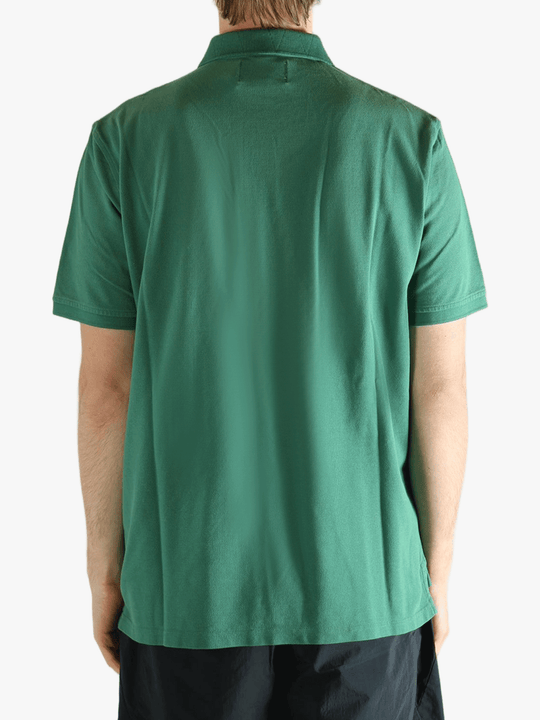 Green t-shirt  worn by a person, showing the t-shirt's fit