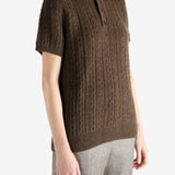 Brown knitwear worn by a person, showing the knitwear fit