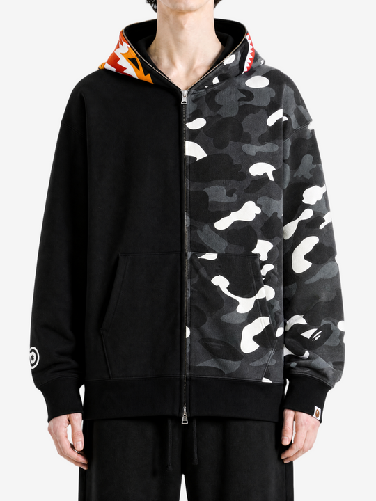 Black hoodie worn by a person, showing the hoodie fit