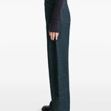 Navy pants worn by a person, showing the pants' fit