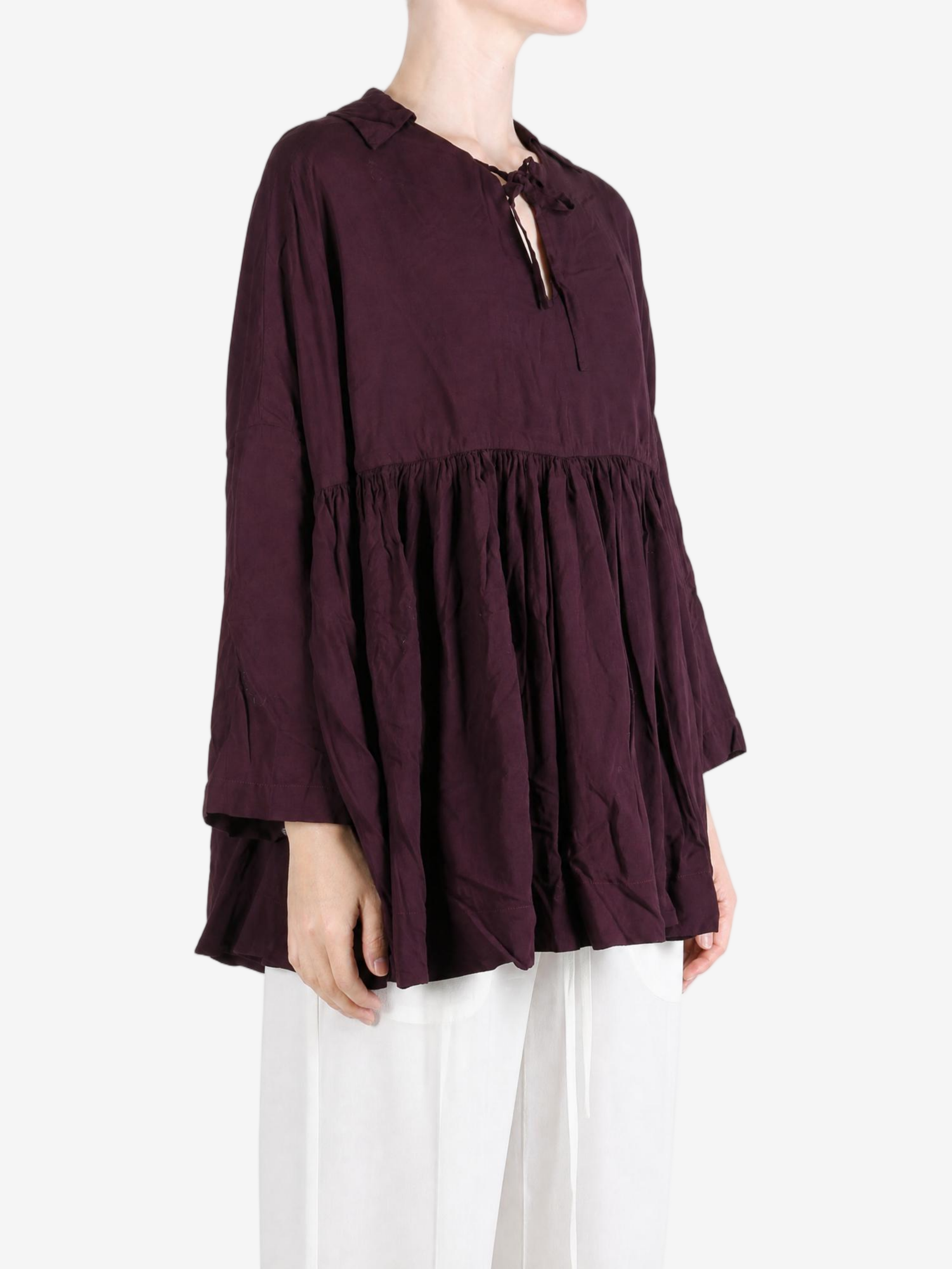 Burgundy top worn by a person, showing the top fit