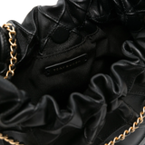 Close up of black bag, showing texture of the leather fabric
