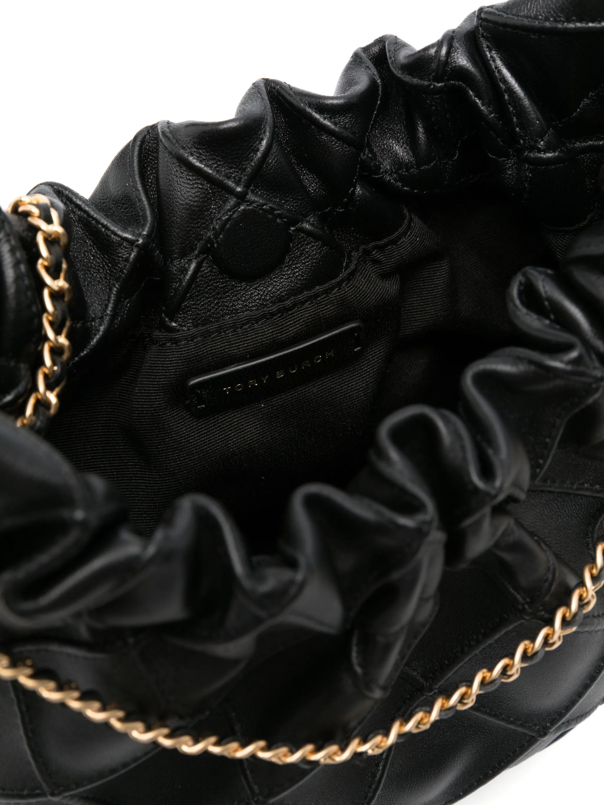 Close up of black bag, showing texture of the leather fabric