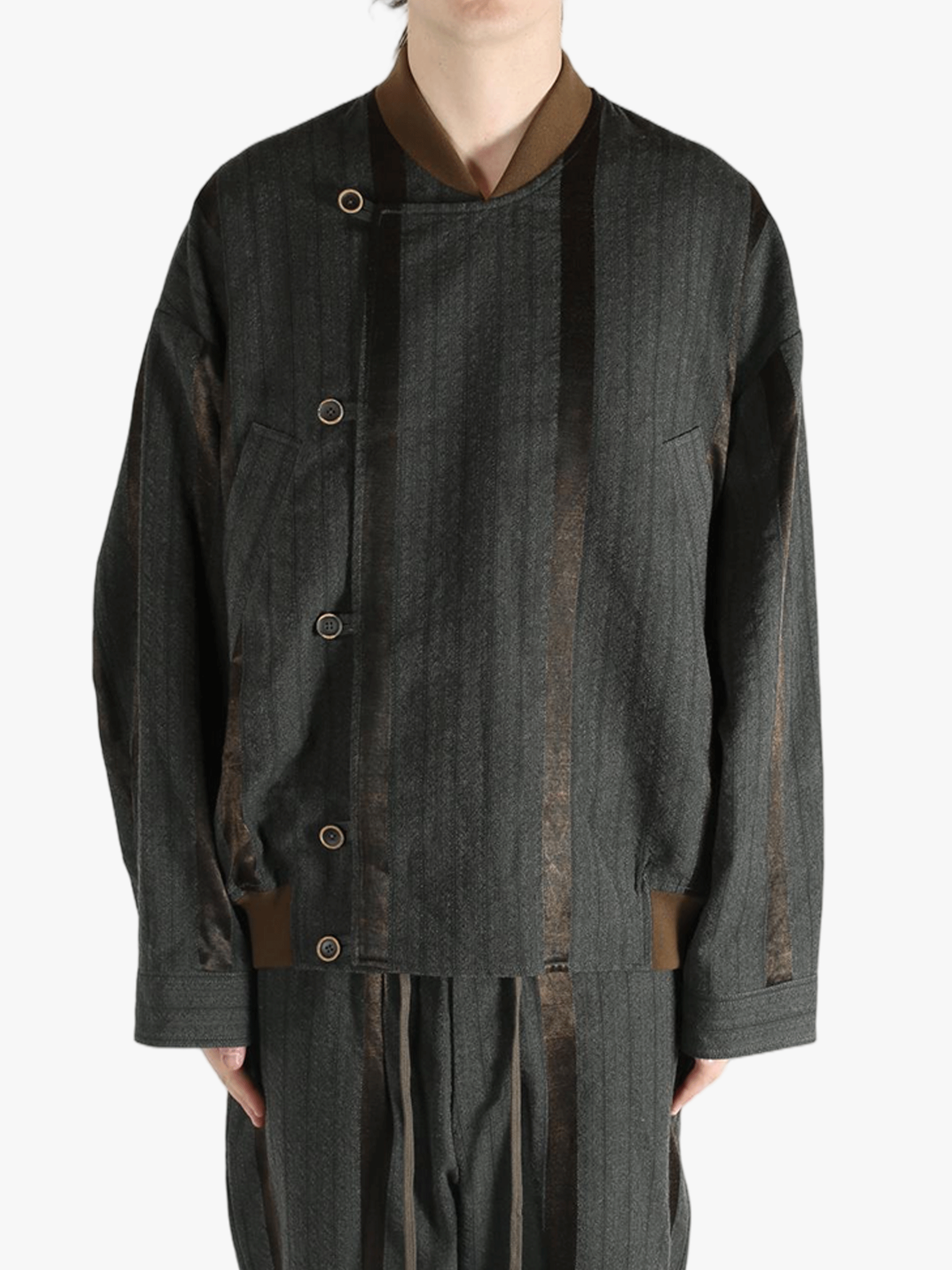 Grey jacket worn by person, showing the jacket's fit