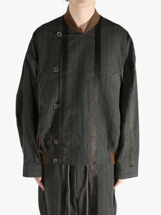 Grey jacket worn by person, showing the jacket's fit