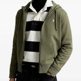Green hoodie worn by a person, showing the hoodie fit