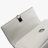 Close up of white bags, showing texture of the fabric