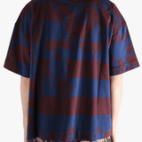 Blue t-shirt worn by a person, showing the t-shirt fit