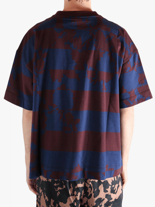 Blue t-shirt worn by a person, showing the t-shirt fit