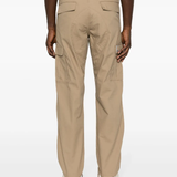 Tan pants worn by a person, showing the pants’ fit