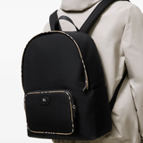 Black bag worn by a person, showing the black bag's fit