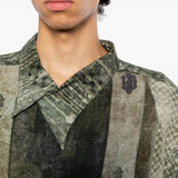 Green shirt worn by a person, showing the shirt fit