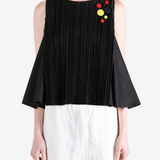 Black top worn by a person, showing the top fit