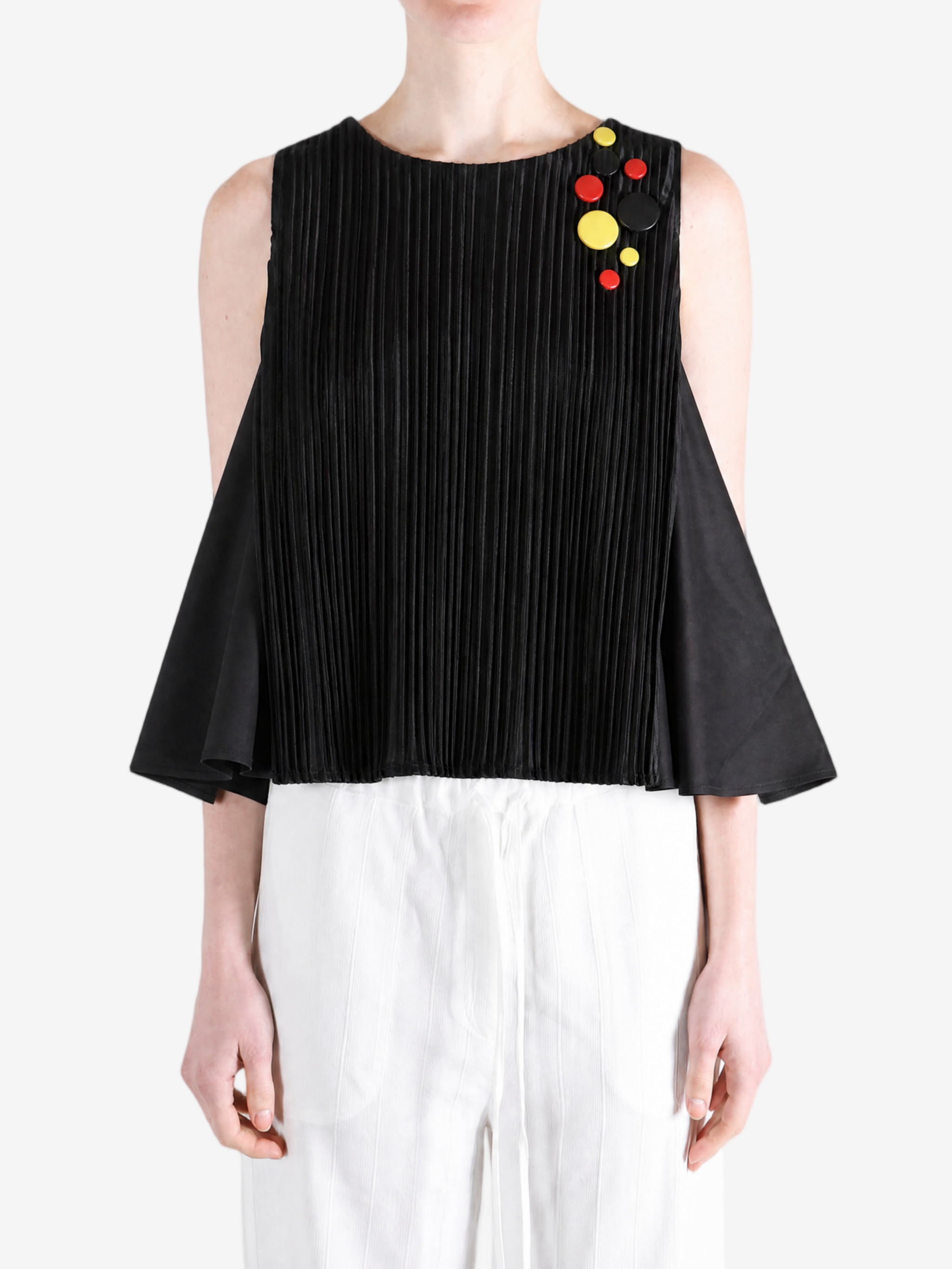Black top worn by a person, showing the top fit