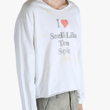 White top worn by a person, showing the top fit