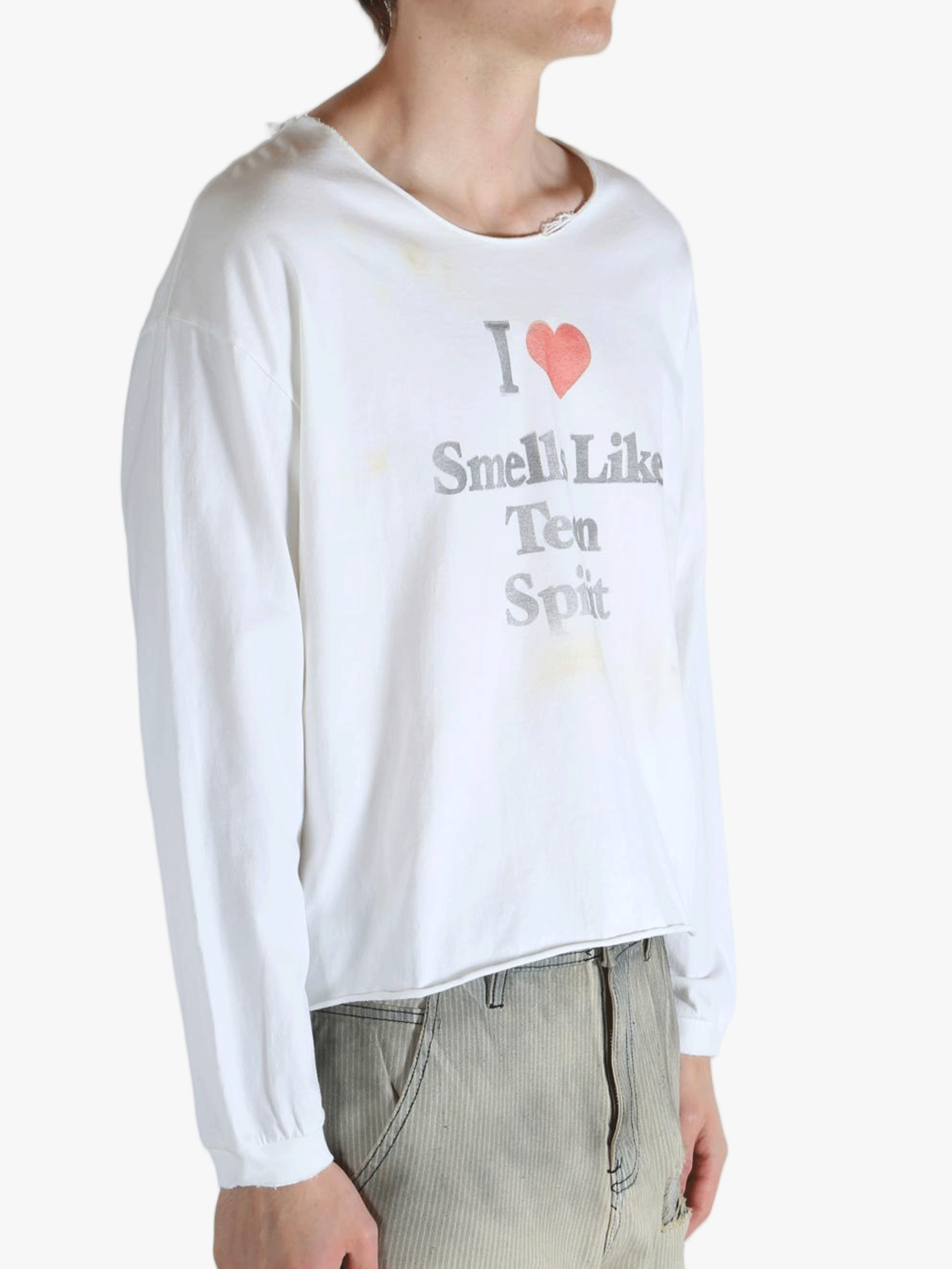 White top worn by a person, showing the top fit