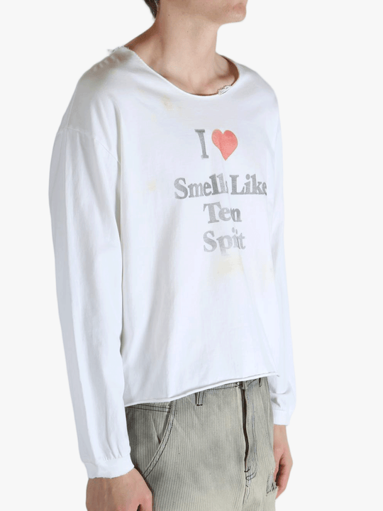 White top worn by a person, showing the top fit