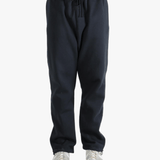 Black pants worn by a person, showing the pants fit