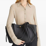 Black bags worn by a person, showing the bags fit