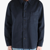 Navy shirts worn by a person, showing the shirts fit