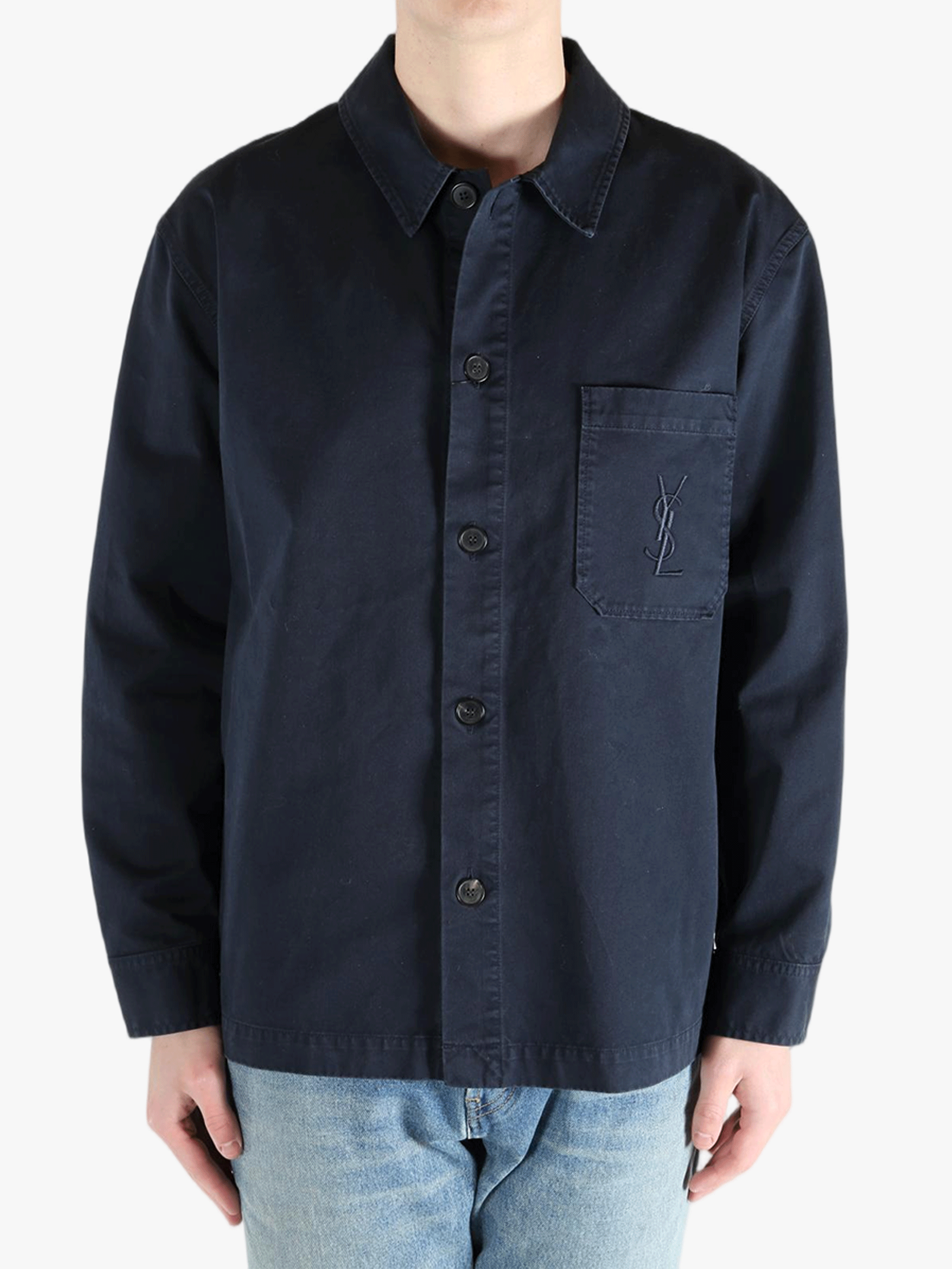 Navy shirts worn by a person, showing the shirts fit