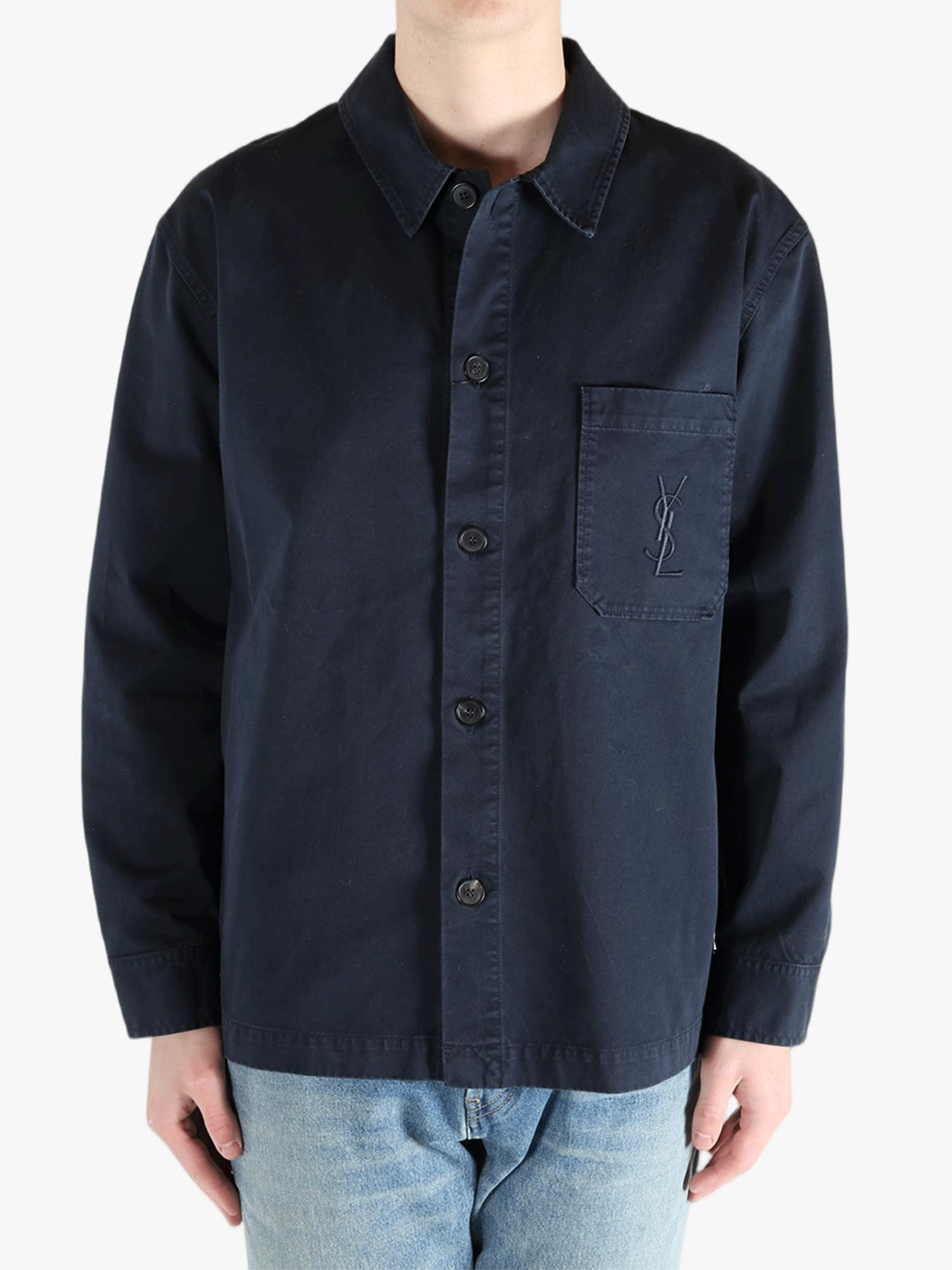 Navy shirts worn by a person, showing the shirts fit