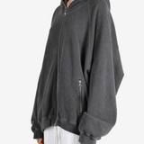 Grey hoodie worn by a person, showing the hoodie fit