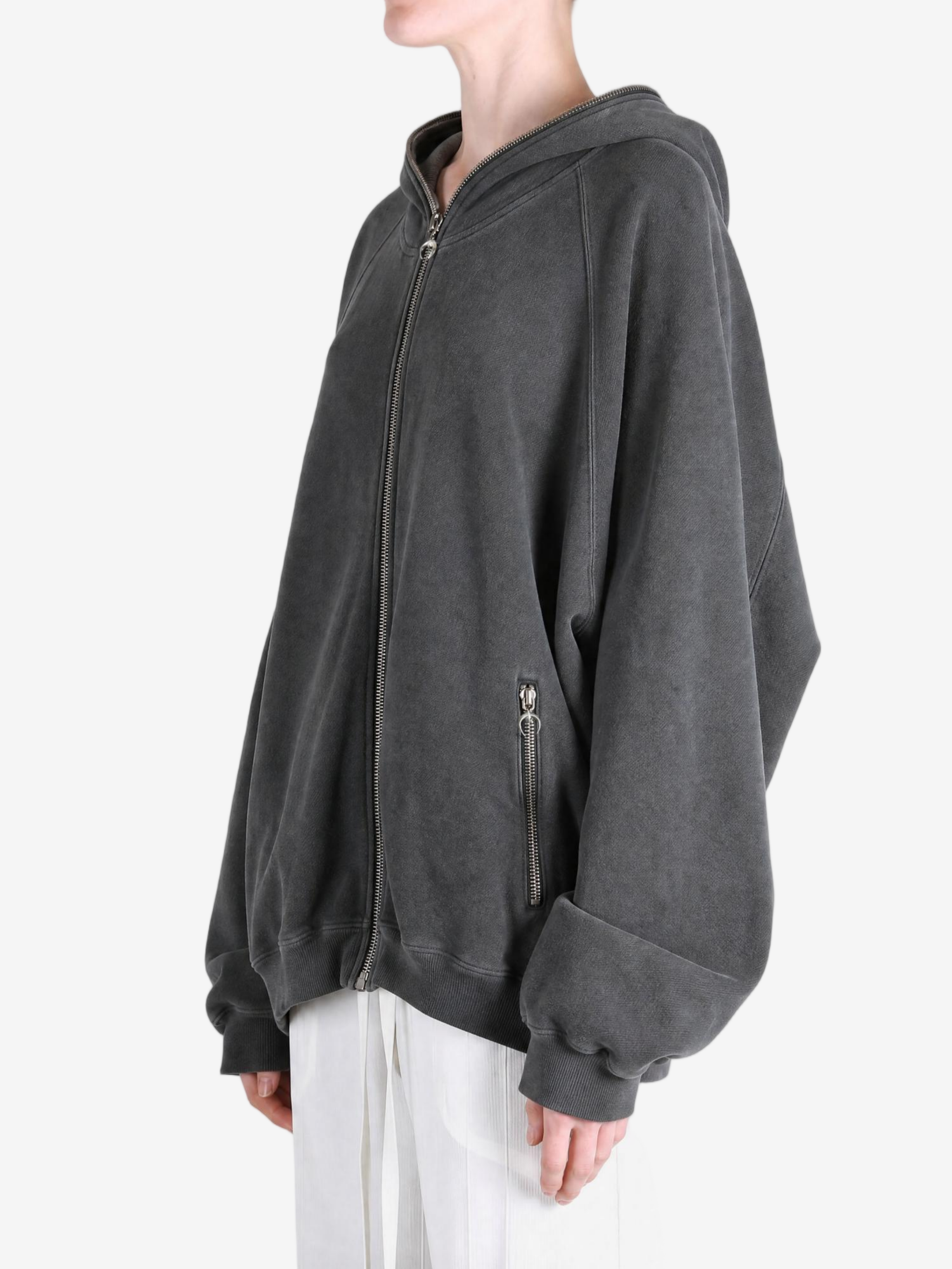 Grey hoodie worn by a person, showing the hoodie fit