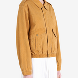 Tan jacket worn by a person, showing the jacket fit