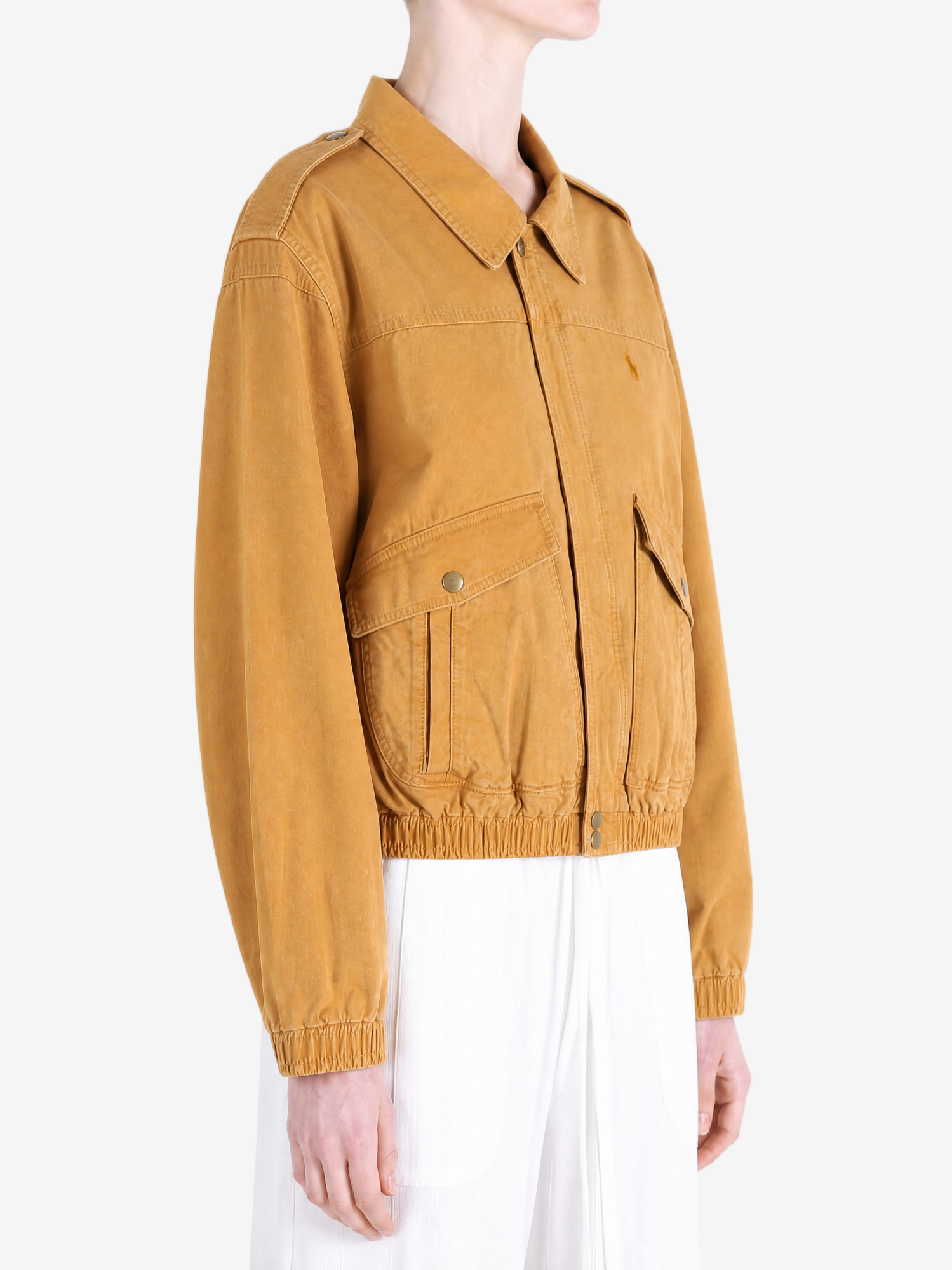 Tan jacket worn by a person, showing the jacket fit