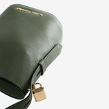 Close up of green bag, showing texture of the cow leather fabric