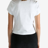 White t-shirt worn by a person, showing the shirt's fit