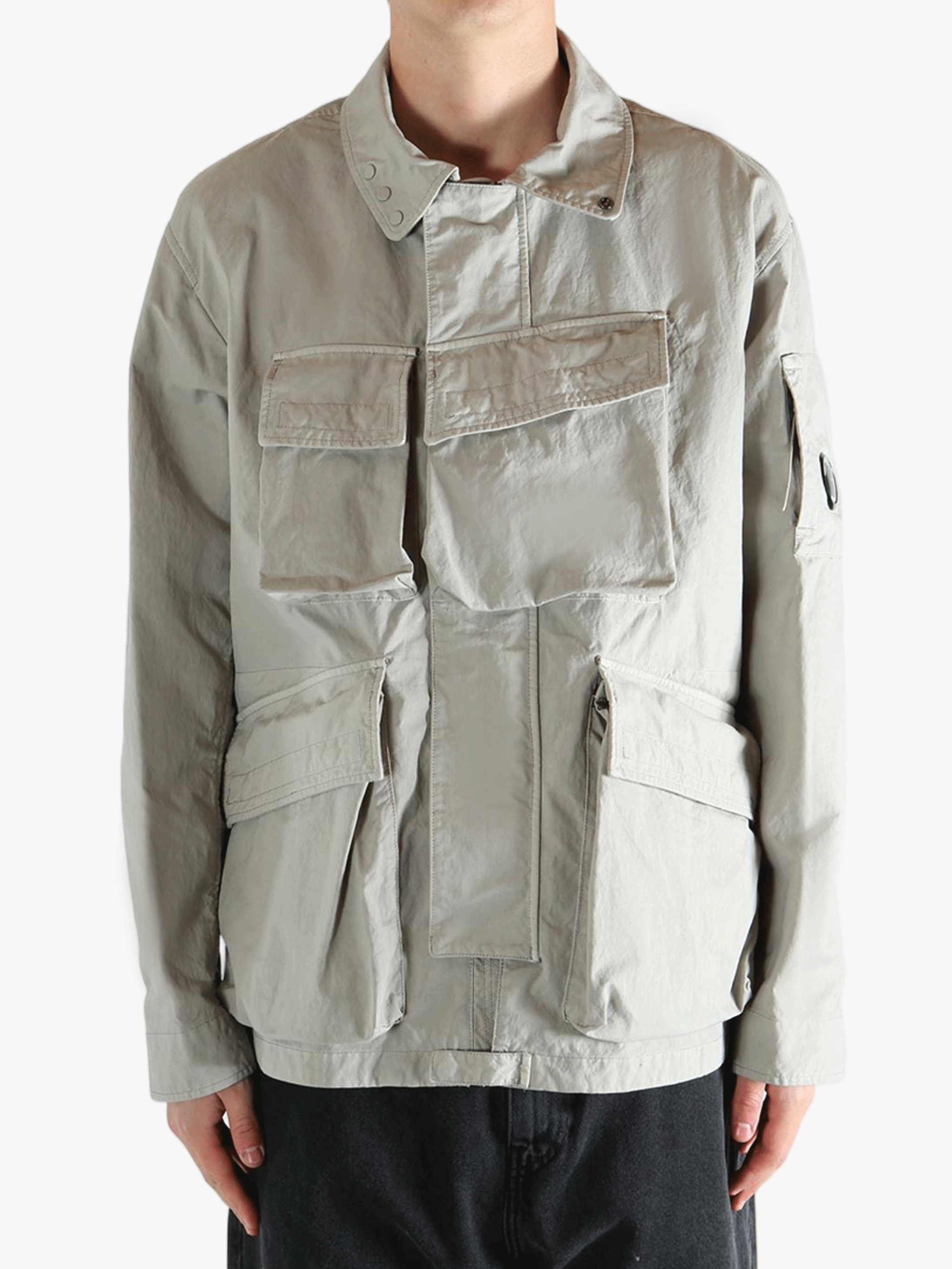 Grey jacket worn by a person, showing the jacket fit