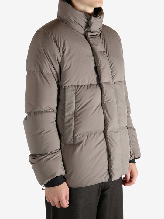 Grey jacket worn by a person, showing the jacket's fit